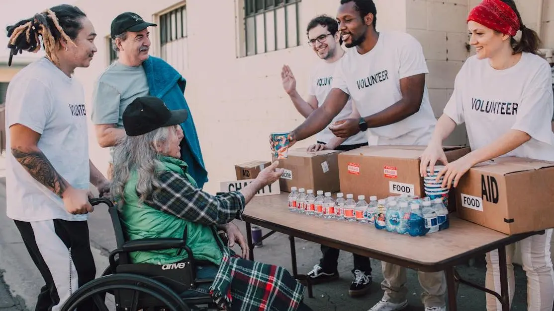 Group of volunteers abroad handing out supplies, representing volunteer abroad programs in action