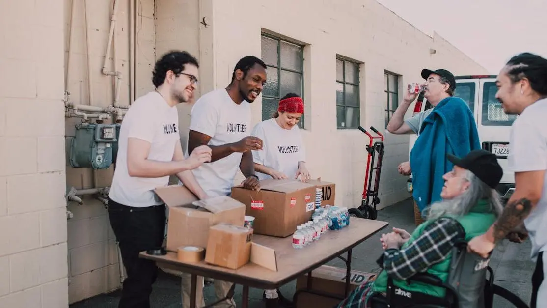 Diverse group offering volunteer opportunities during outdoor community service activity