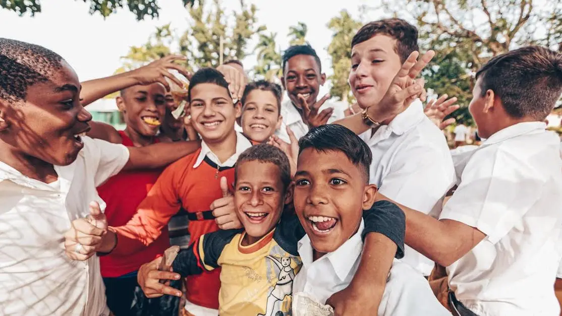 Diverse teens smiling together outdoors, representing volunteer options for teens