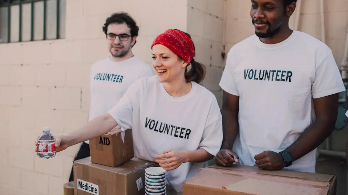 Volunteers distributing aid at an outdoor donation center for Martin Luther King Day volunteer opportunities