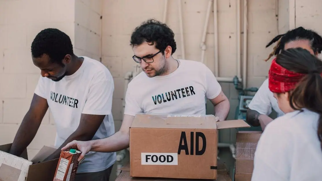 Volunteers packing food and aid boxes during a charity drive for MLK Day volunteer opportunities