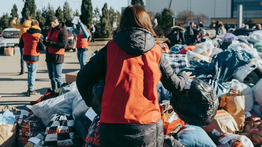 Teens sorting clothing donations in Vilnius charity drive—volunteering opportunities for 14 year olds
